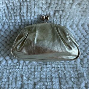 Small gold clutch with rhinestone closure